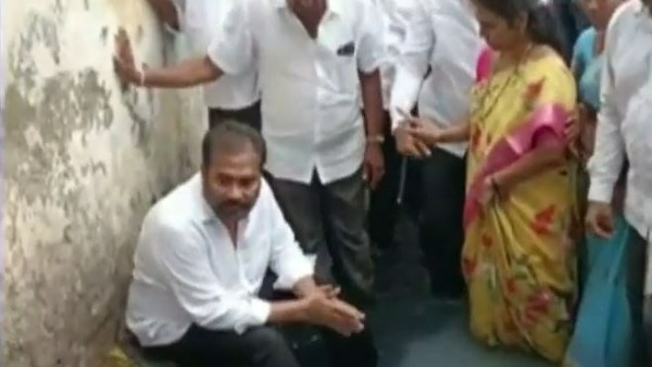Ruling YSR Congress Party MLA Kotamreddy Sridhar Reddy protest in drainage canal in Nellore