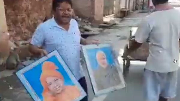 చెత్తబండిలో మోడీ, యోగి ఫొటోలు చెత్తబండిలో మోడీ, యోగి ఫొటోలు