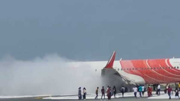  Passengers emergency evacuation in an Air India Express flight after smoke filled in the cabin