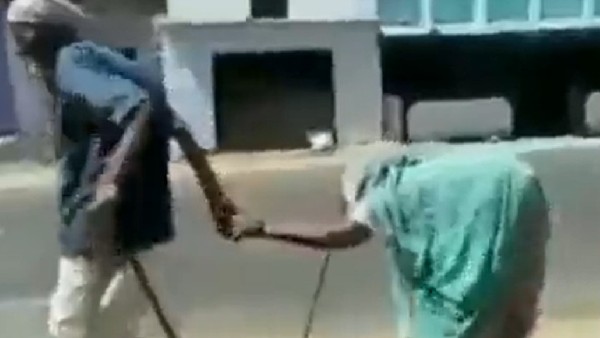 A video of an elderly couple walking on the road is going viral on social media A video of an elderly couple walking on the road is going viral on social media