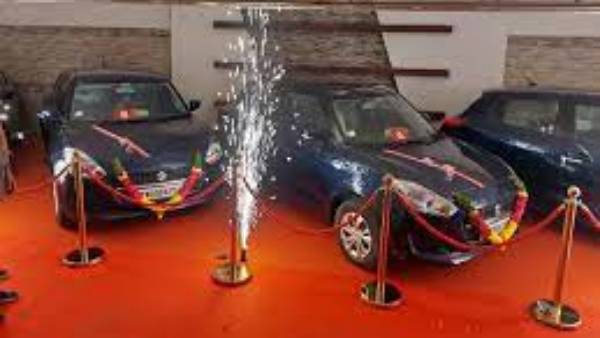 Businessman gives cars and bikes to staff Businessman gives cars and bikes to staff