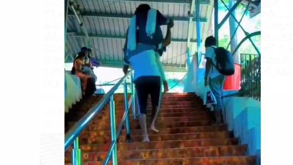 భార్యను భర్త ఎత్తుకొని తిరుమల కొండ ఎక్కటంపై అందరి దృష్టి 