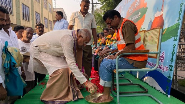 ap minister venugopala krishna bent before sanitary workers for their service on pongal