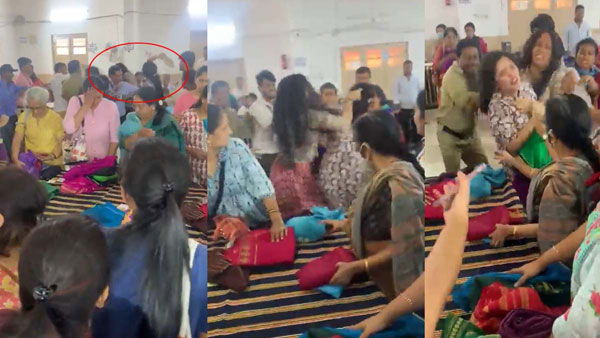 Women holding their hair and slapping them in a showroom for Mysuru silk sarees in Bengaluru