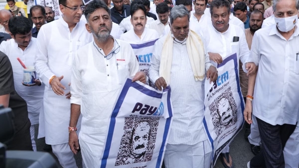 Opposition party leaders with slogans of Pay CS against Pay CM and Pay PM in Karnataka.