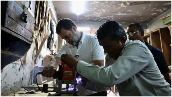 Rahul Gandhi interacts with carpenters at Kirti Nagar in Delhi