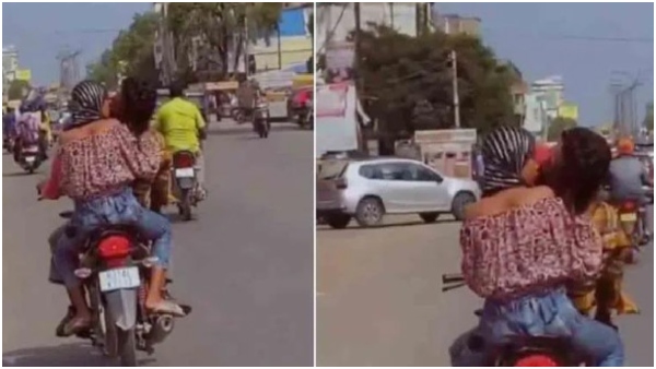 Viral Video: couple seen kissing on moving bike, cops take action Viral Video: couple seen kissing on moving bike, cops take action