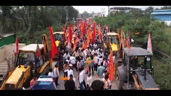 Telangana BJP mla candidate takes out bulldozer rally to file his nomination