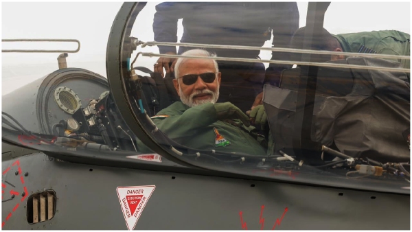 pm modi flies in tejas aircraft in bengaluru, lauds countrys capabilities pm modi flies in tejas aircraft in bengaluru, lauds countrys capabilities