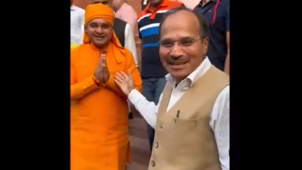 Adhir Ranjan Chowdhury and BJP MP Yogi Balaknath share a light moment at Parliament