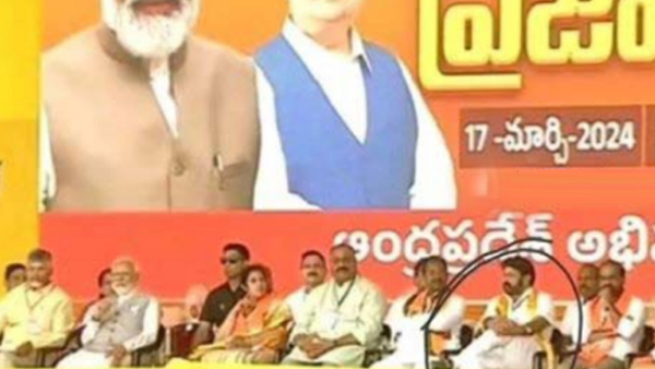 TDP MLA balakrishna sitting cross-legged in front of Prime Minister Modi