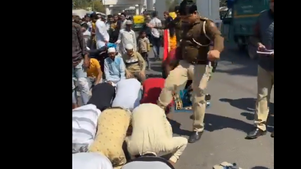 Delhi cop suspended for kicking Muslim men offering namaz on road Delhi cop suspended for kicking Muslim men offering namaz on road