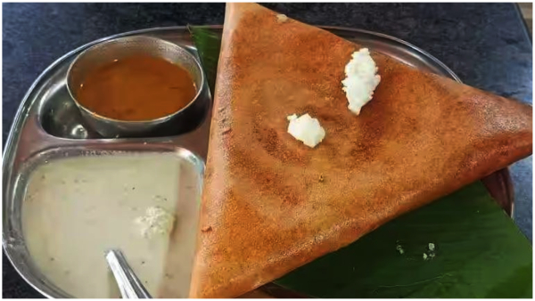 Long queues at Nisarga Grand Hotel in Bengaluru offering free tiffin to voters who display their inked fingers