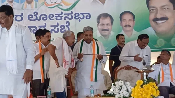 A fan who gifted Karnataka CM Siddaramaiah with a cane on stage