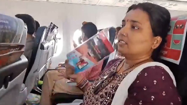 SpiceJet passengers wait inside an flight without AC