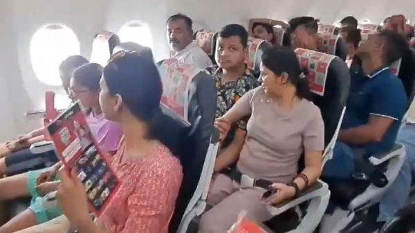 SpiceJet passengers wait inside an flight without AC