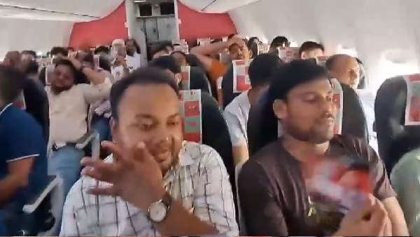 SpiceJet passengers wait inside an flight without AC