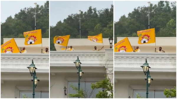 TDP leaders hoisted the Party s flag at Rishikonda building in Visakhapatnam TDP leaders hoisted the Party s flag at Rishikonda building in Visakhapatnam