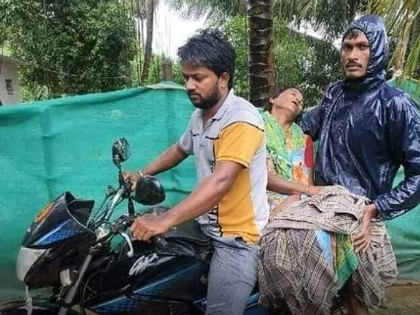 A Man forced to carry a body on two-wheeler in Andhra Pradesh