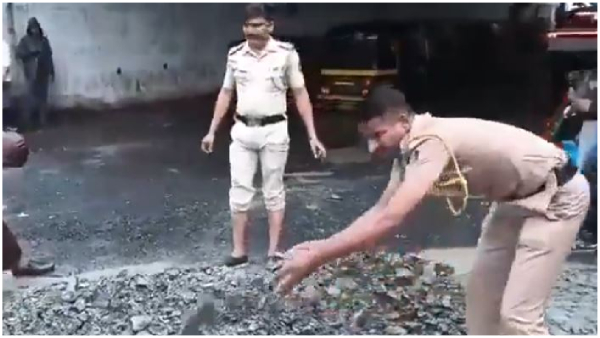 Police fill potholes on road in Mumbai Aaditya Thackeray attacks Mahayuti govt