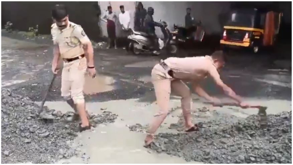 Police fill potholes on road in Mumbai Aaditya Thackeray attacks Mahayuti govt