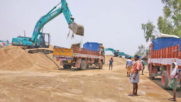 Common people queuing near free sand stock points in Andhra Pradesh Common people queuing near free sand stock points in Andhra Pradesh