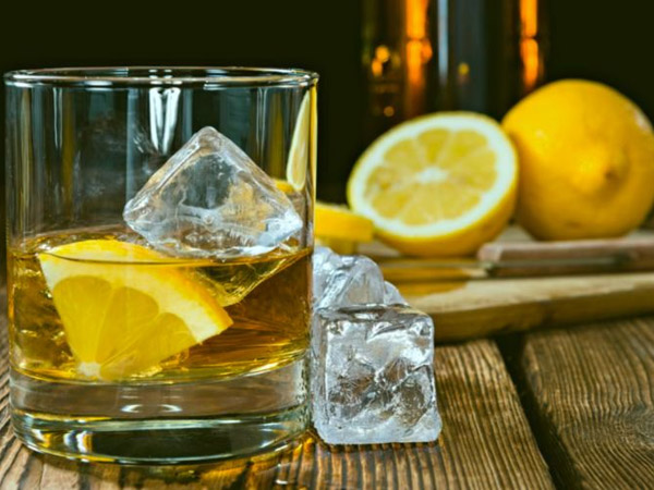 Add lemon juice and two ice cubes to the whiskey observe how it tastes