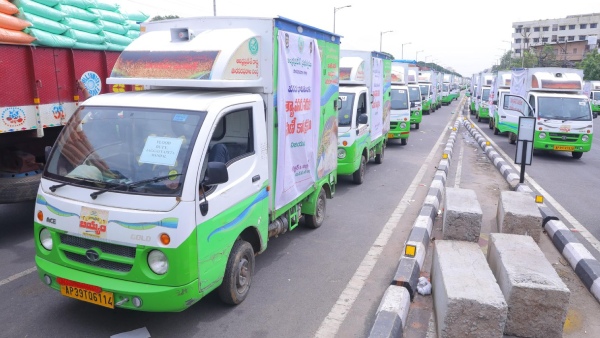 Chandrababu govt kick starts supply food grains to the flood victims in MDU Vehicles Chandrababu govt kick starts supply food grains to the flood victims in MDU Vehicles