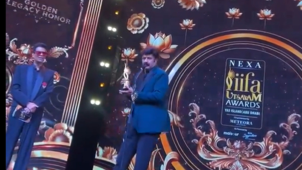 aishwarya rai takes blessings from nandamuri balakrishna in iifa awards program