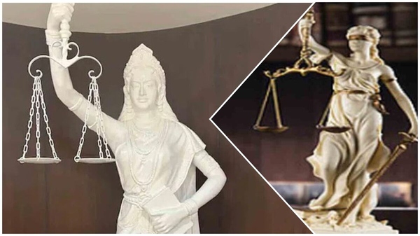 lady of justice without a blindfold and a sword in hand has been installed in the Supreme Court