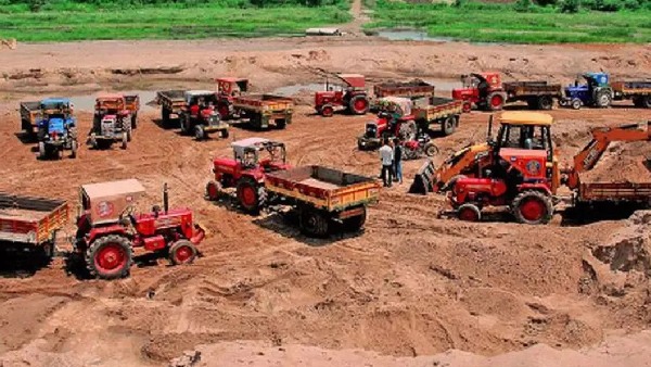 Politicians digging sand illegally in a pond in Punganur constituency of Chittoor district