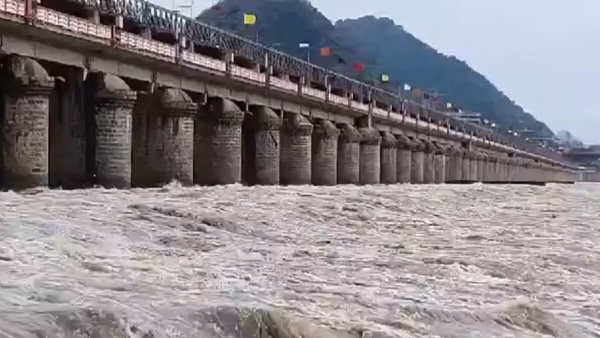 Officials lift crest gates of from Prakasam Barrage in Vijayawada for discharge of floodwater Officials lift crest gates of from Prakasam Barrage in Vijayawada for discharge of floodwater
