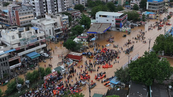 another flood warning to Vijayawada as increase in krishna river inflows at prakasam barrage