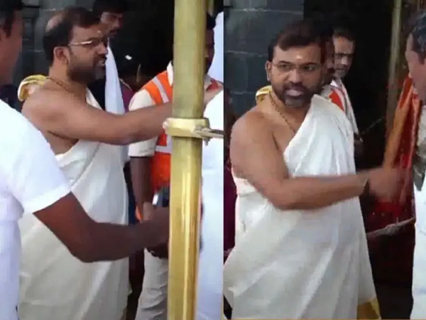 TTD employees staging a demonstration in Tirupati demands action against Board Member Naresh Kumar