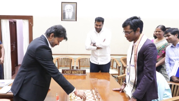 CM Vijay vs Praggnanandhaa Chess Prodigy Checkmates Tamil Nadu CM Wins Rs 50 Lakh Full Details CM Vijay vs Praggnanandhaa Chess Prodigy Checkmates Tamil Nadu CM Wins Rs 50 Lakh Full Details