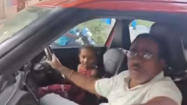 SI booked in minor driving case video viral his six-and-a-half-year-old granddaughter driving car SI booked in minor driving case video viral his six-and-a-half-year-old granddaughter driving car