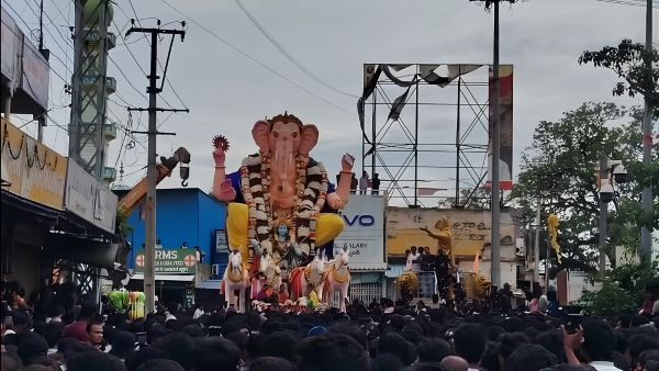 Helicopter Showers Flower Petals on 50-Foot Garidi Ganesh During Grand Immersion Rally in Hindupur Helicopter Showers Flower Petals on 50-Foot Garidi Ganesh During Grand Immersion Rally in Hindupur