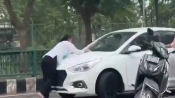 Lucknow Atrocity in the middle of the road in Young woman dragged by car and thrown to the ground Lucknow Atrocity in the middle of the road in Young woman dragged by car and thrown to the ground