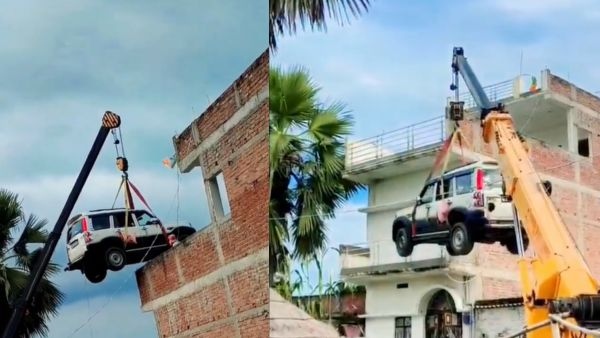 Bihar Man Uses Crane to Lift Mahindra Scorpio Classic SUV to Rooftop to Prevent Theft Before Going Abroad Bihar Man Uses Crane to Lift Mahindra Scorpio Classic SUV to Rooftop to Prevent Theft Before Going Abroad