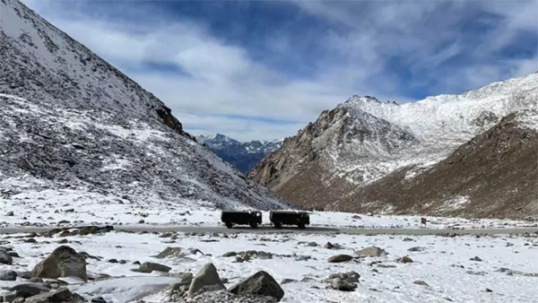 A checkmate to China India cuts through a high-altitude Himalayan mountain to build a road