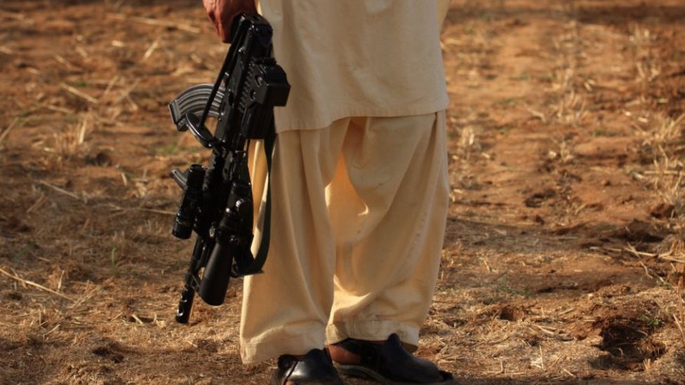 Taliban militant with a rifle Taliban militant with a rifle