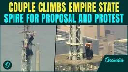 Couple Kisses On Top of Empire State Building While Protesting WIth Peace Banner At 1452 Ft | VIDEO